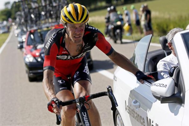 epa04834279 BMC Racing Team rider Daniel Oss of Italy receives medical assistance following a crash at the bottom of the Cote de Bohissau near Andenne, Belgium, 06 July 2015, during the 3rd stage of the 102nd edition of the Tour de France 2015 cycling race over 159.5km between Anvers and Huy, Belgium. EPA/YOAN VALAT
