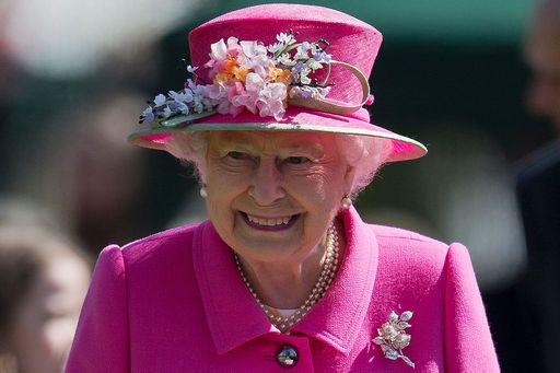 Britain's Queen Elizabeth II smiles as she leaves after attending the opening of a bandstand at Alexandra Gardens in Windsor, west of London, on April 20, 2016, the day before her 90th birthday. Queen Elizabeth II is set to celebrate her 90th birthday on April 21, with a family gathering and a cake baked by a reality television star, as a new poll finds Britain's longest serving monarch is as popular as ever. The queen has reigned for more than 63 years and shows no sign of retiring, even if she has in recent years passed on some of her duties to the younger royals. / AFP PHOTO / JUSTIN TALLIS