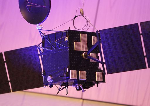 A model of the space probe Rosetta is pictured at the headquarters of the European Space Operations Centre (ESOC) of the European Space Agency (ESA) in Darmstadt, western Germany, on September 30, 2016, the day of the controlled descent of the ESA space probe Rosetta onto the surface of Comet 67P/Churyumov-Gerasimenko. Europe's Rosetta spacecraft was headed for a mission-ending crash on the comet it has stalked for two years, a dramatic conclusion to a 12-year odyssey to demystify our Solar System's origins. / AFP PHOTO / DANIEL ROLAND