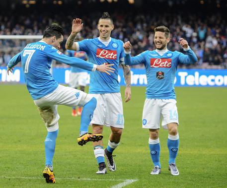 Napoli's José María Callejón, left, celebrates with teammates Marek Hamík, center, and Dries Mertens, after scoring during a Serie A soccer match between Napoli and Empoli, at the San Paolo stadium in Naples, Italy, Sunday, Jan. 31, 2016. (ANSA/AP Photo/Salvatore Laporta)